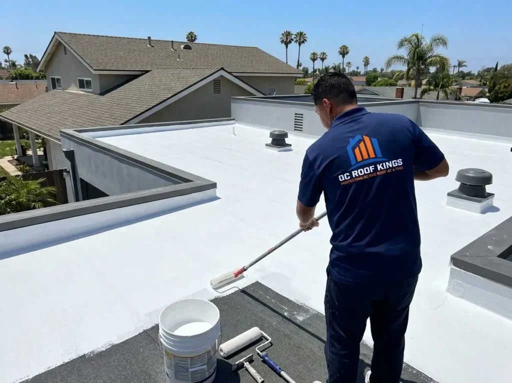 White cool roof coating on a flat roof section over a home addition